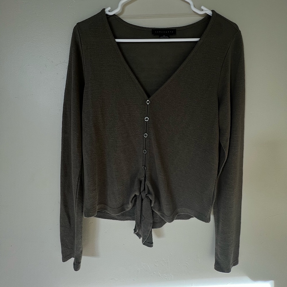 Military green long sleeve top with tie detail in front. Size XS but fits large.